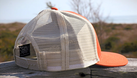 side of orange portarod hat with mesh back  — seek outdoors