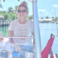 woman wearing i'm a shellfish person cropped tee on boat — seek outdoors